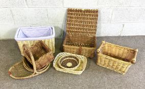 A handy selection of wicker baskets, including a cut flower basket, hamper, two upholstered