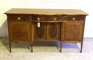 A Georgian style mahogany sideboard, with central bow drawer and niche with two cabinet doors,