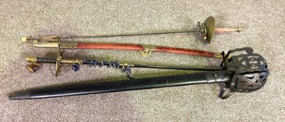 Four assorted swords, including a vintage style fencing rapier; a reproduction Scottish basket