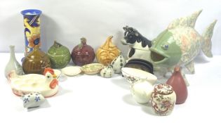 A set of novelty ceramic kitchen jars, including a large fish, a covered tureen in form of a cow,