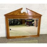 A large modern walnut veneered overmantel mirror with broken arch surmount and bevelled plate