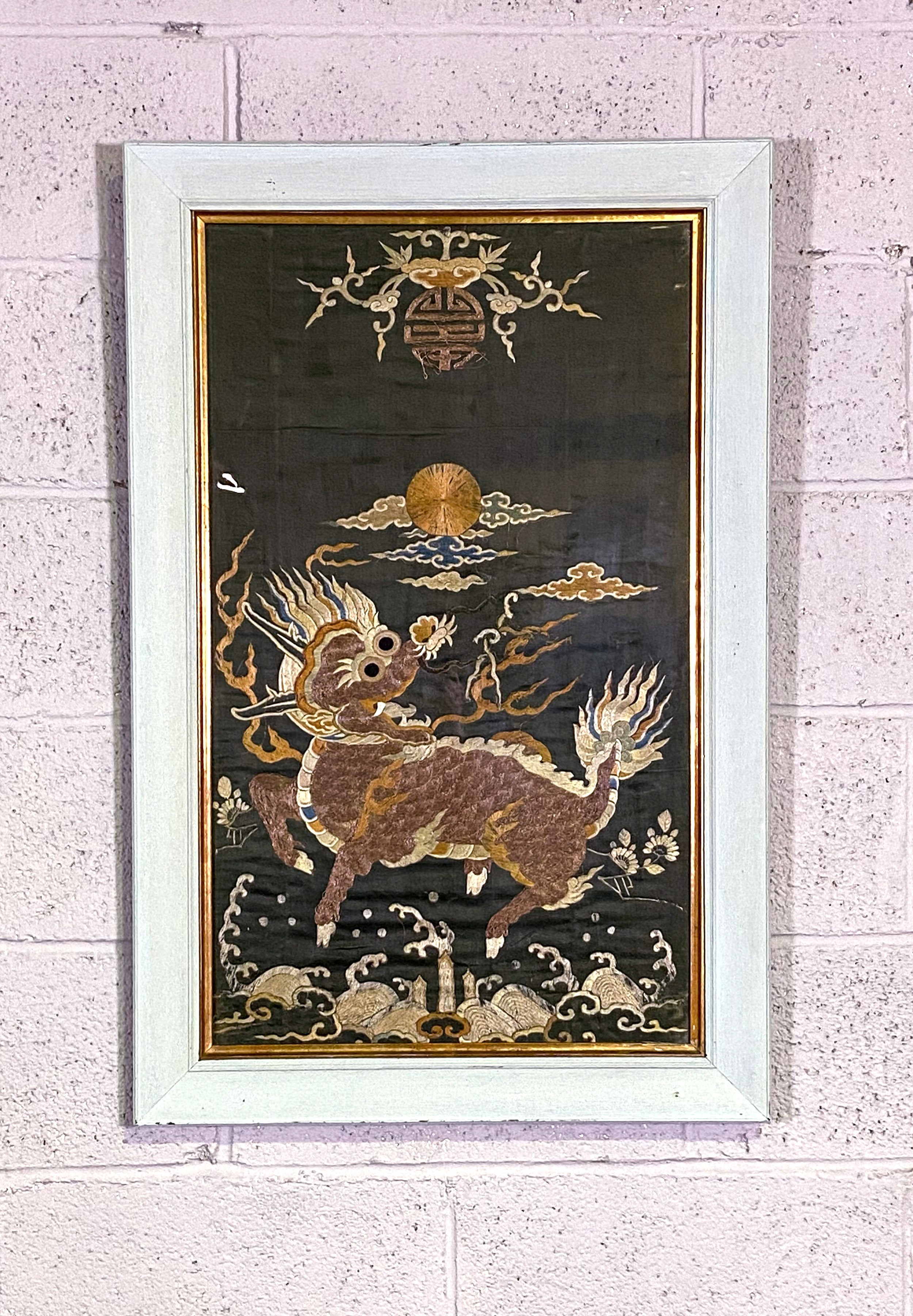 A Chinese silk and embroidered panel, decorated with a Qilin (A mythological beast), with sun above, - Image 2 of 3