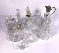 A selection of assorted crystal glass decanters and a claret jug with a silver plated top (a lot)