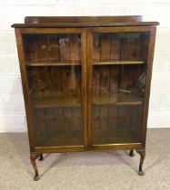 A vintage beechwood bookcase, with glazed doors, 48cm high