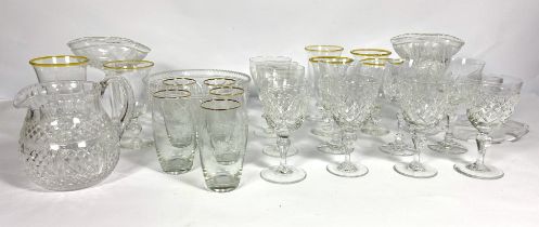 A selection of table glassware, including five etched glass tall water glasses; a crystal glass