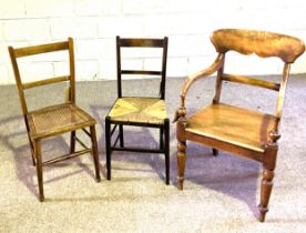 A 19th century mahogany armchair with curved and serpentine mouded back and turned legs, seat later;