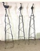 Three vintage wrought iron garden obelisks, each surmounted by a novelty duck (3)