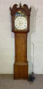 A Victorian oak cased eight day longcase clock, signed Davidson, with a painted arched dial, two