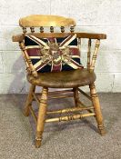 A late Victorian ash framed smoker's bow armchair,  with union flag and armorial cushion (2)
