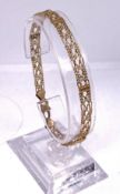 A 9 carat gold filigree bracelet, hallmarked 375, 5g, 19cm long, in associated box