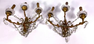 A pair of Louis XVI style gilt metal wall lights, each with three lights (2)