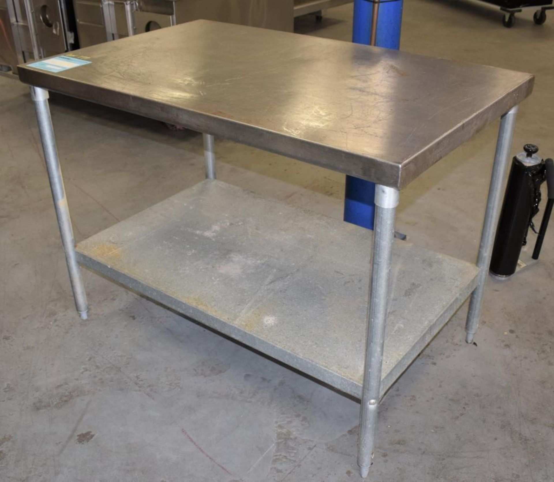 AERO Manufacturing Stainless Steel Top Table. Approximate 30" wide x 48" long x 36" tall. With botto