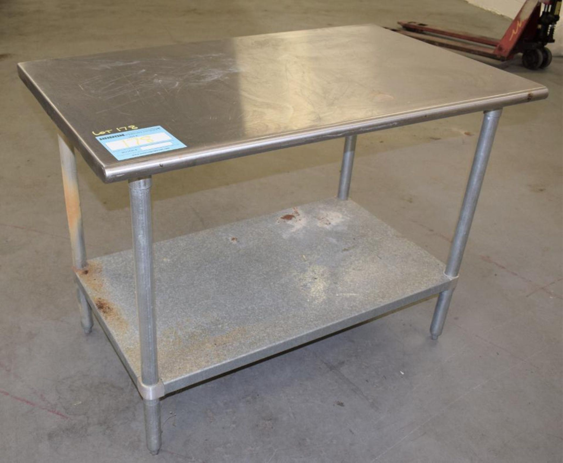 TABCO Stainless Steel Top Table. Approximate 30" wide x 48" long x 36" tall. With bottom shelf and (