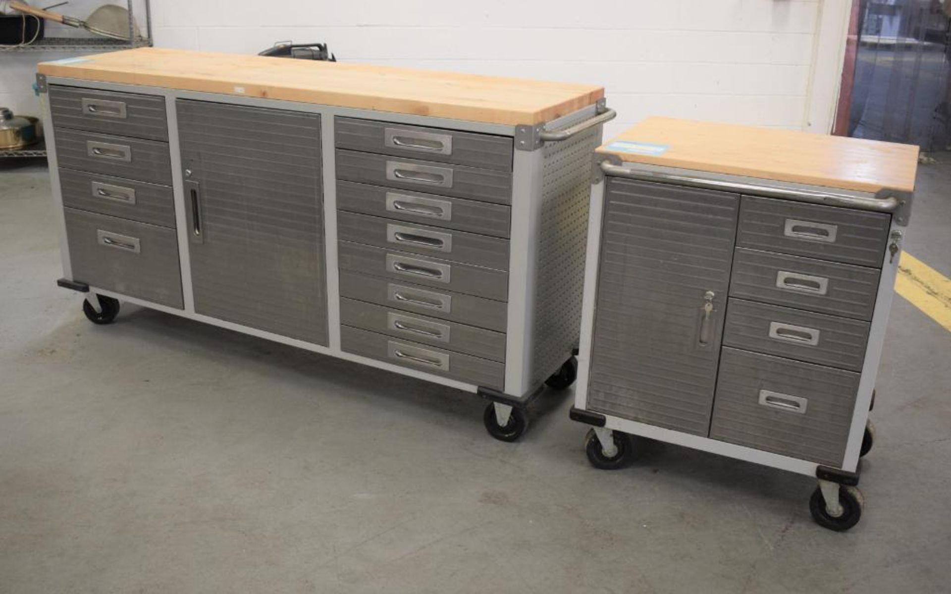 Lot Of (2) UltraHD Rolling Workbench Cabinets. (1) 12 drawer, (1) cabinet with wood top. (1) 4 drawe