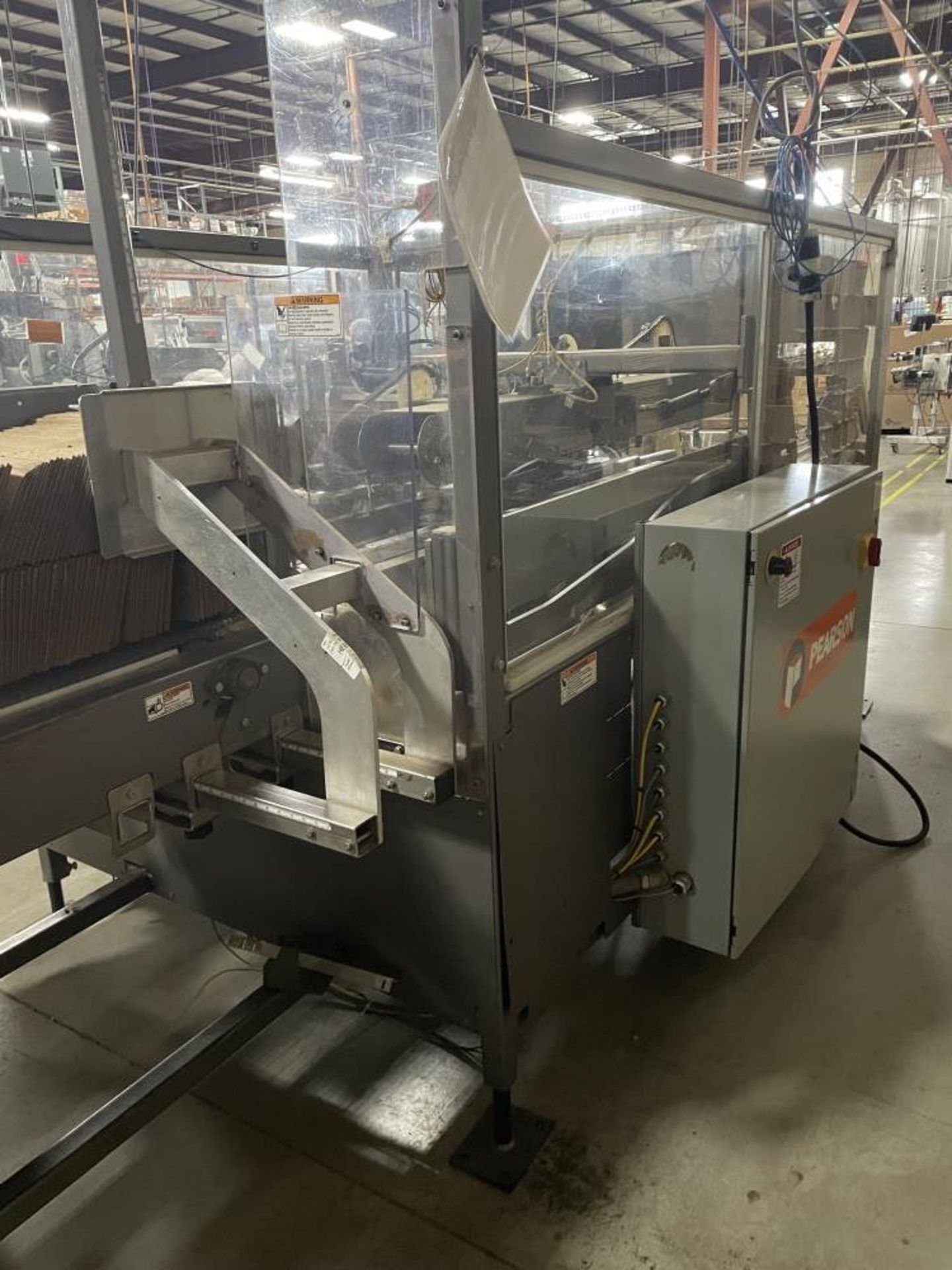 Used- Pearson Case Erector with Glue Bottom Seal, Model CE350. Machine is capable of up to 35 cases