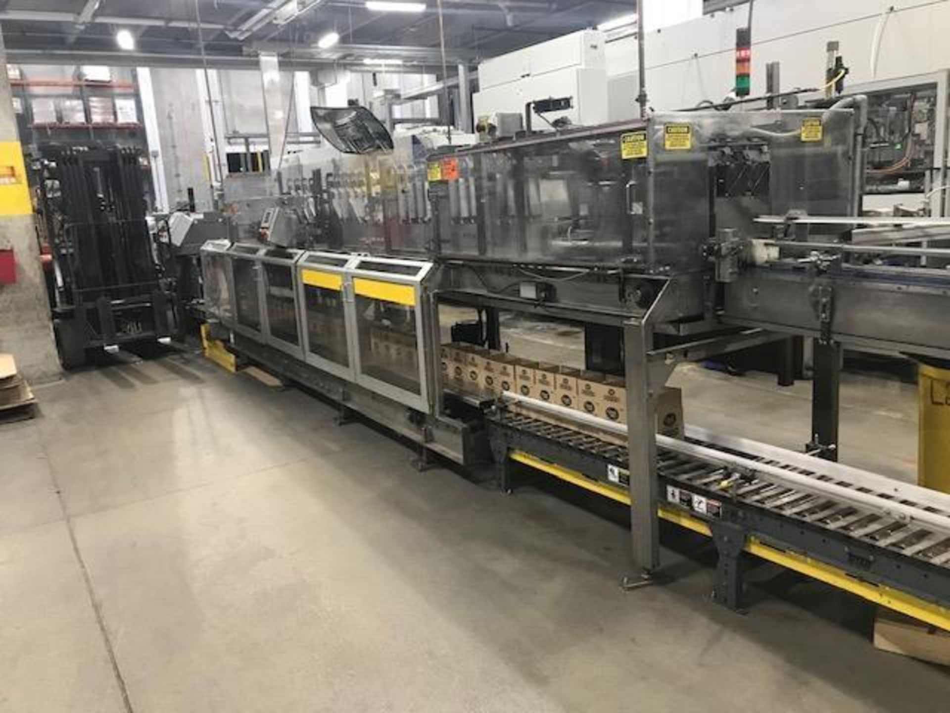 Used-Hartness Model 835 Automatic Descending Drop Case Packer. Capable of speeds from 5 to 25 cases