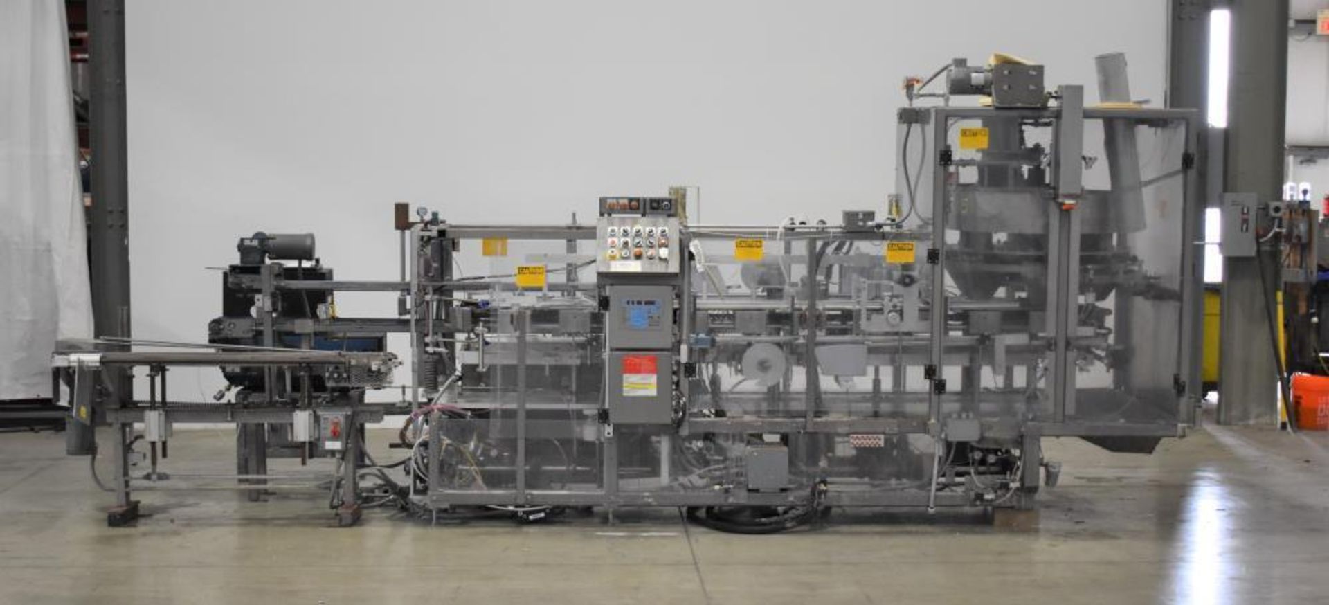 Used- Clybourn Model Spectrum 324 Automatic Vertical Cartoner with 6 Pocket Volumetric Filler. Capab