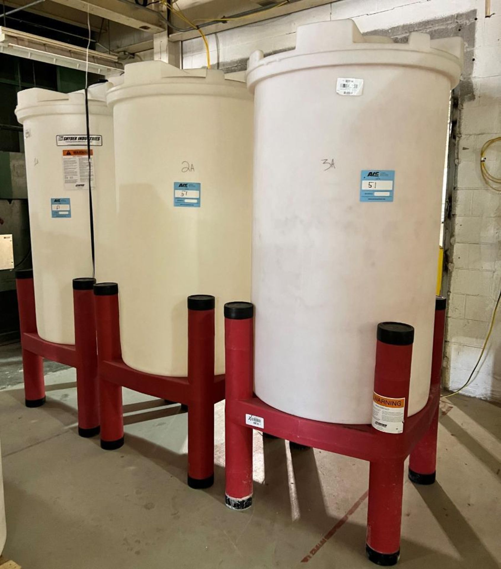 Lot Of (3) SSI Approximate 250 Gallon White Poly Tanks With Stands.