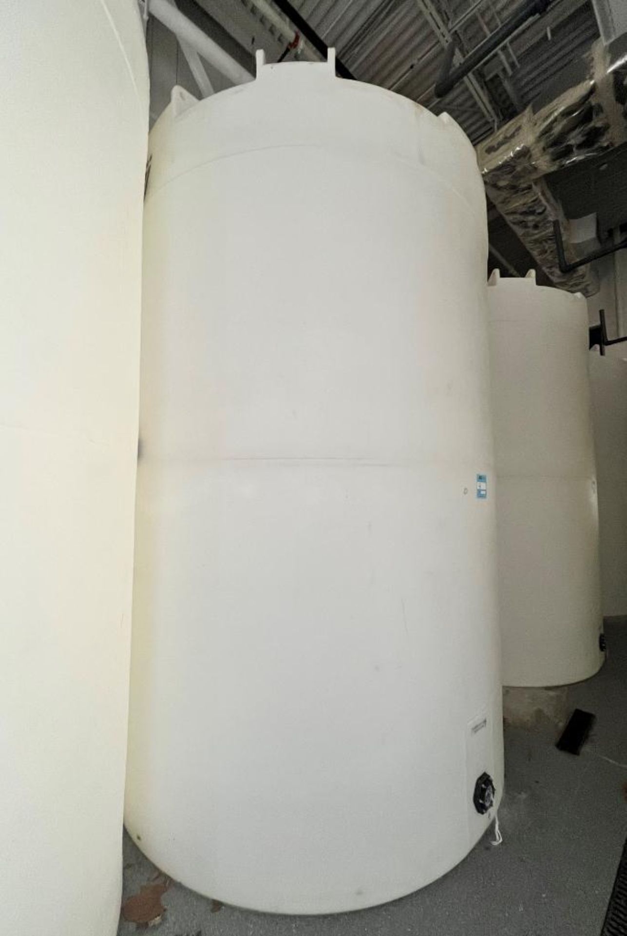 SII Approximate 5000 Gallon White Poly Tank. Side bottom outlet.