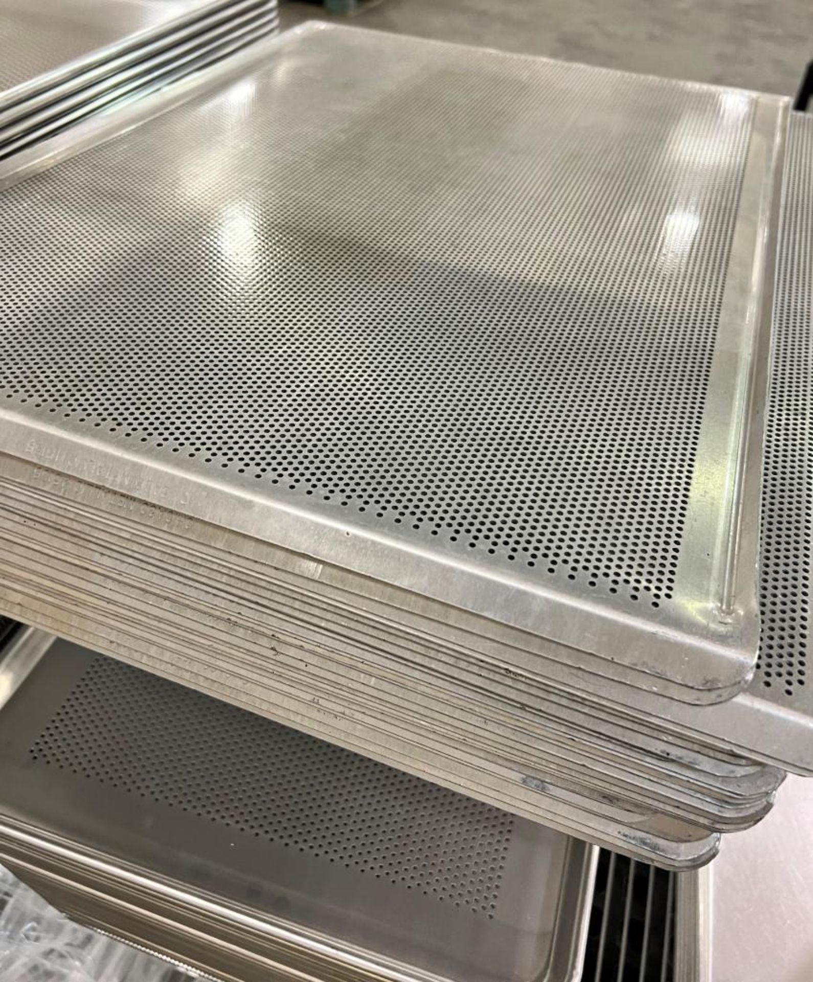 Lot Of Bakery Trays. Approximate (232) solid 18" x 26" x 1" deep, approximate (84) perforated 18" x - Image 8 of 8