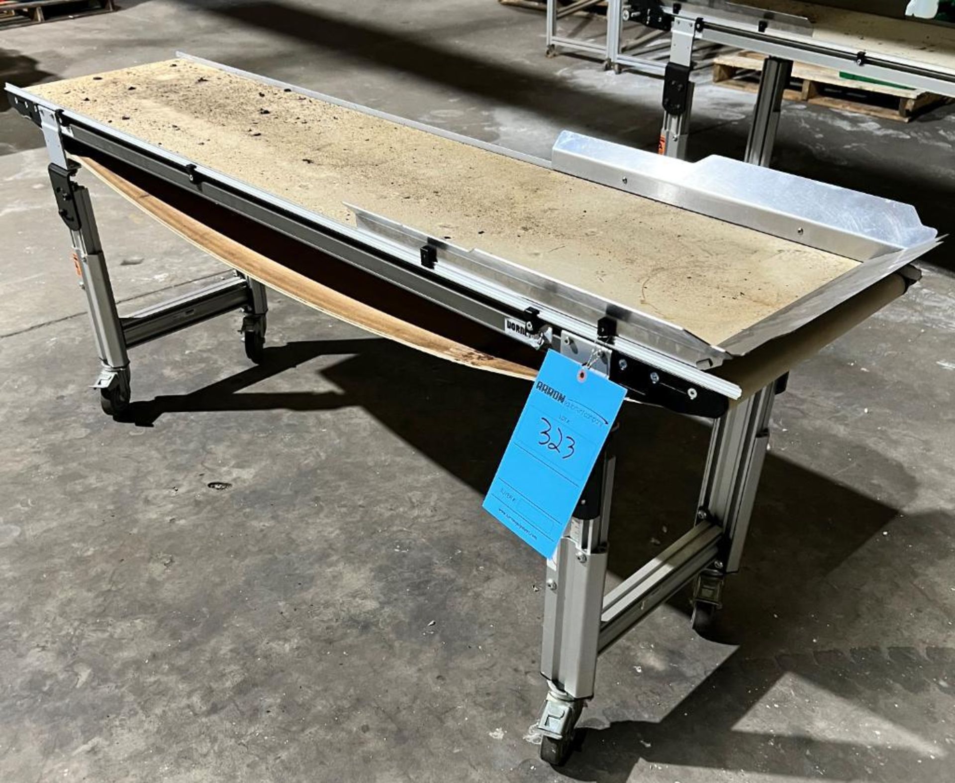 Dorner Rubber Belt Conveyor. Approximate 16" wide x 72" long belt, aluminum frame. Last used with LO