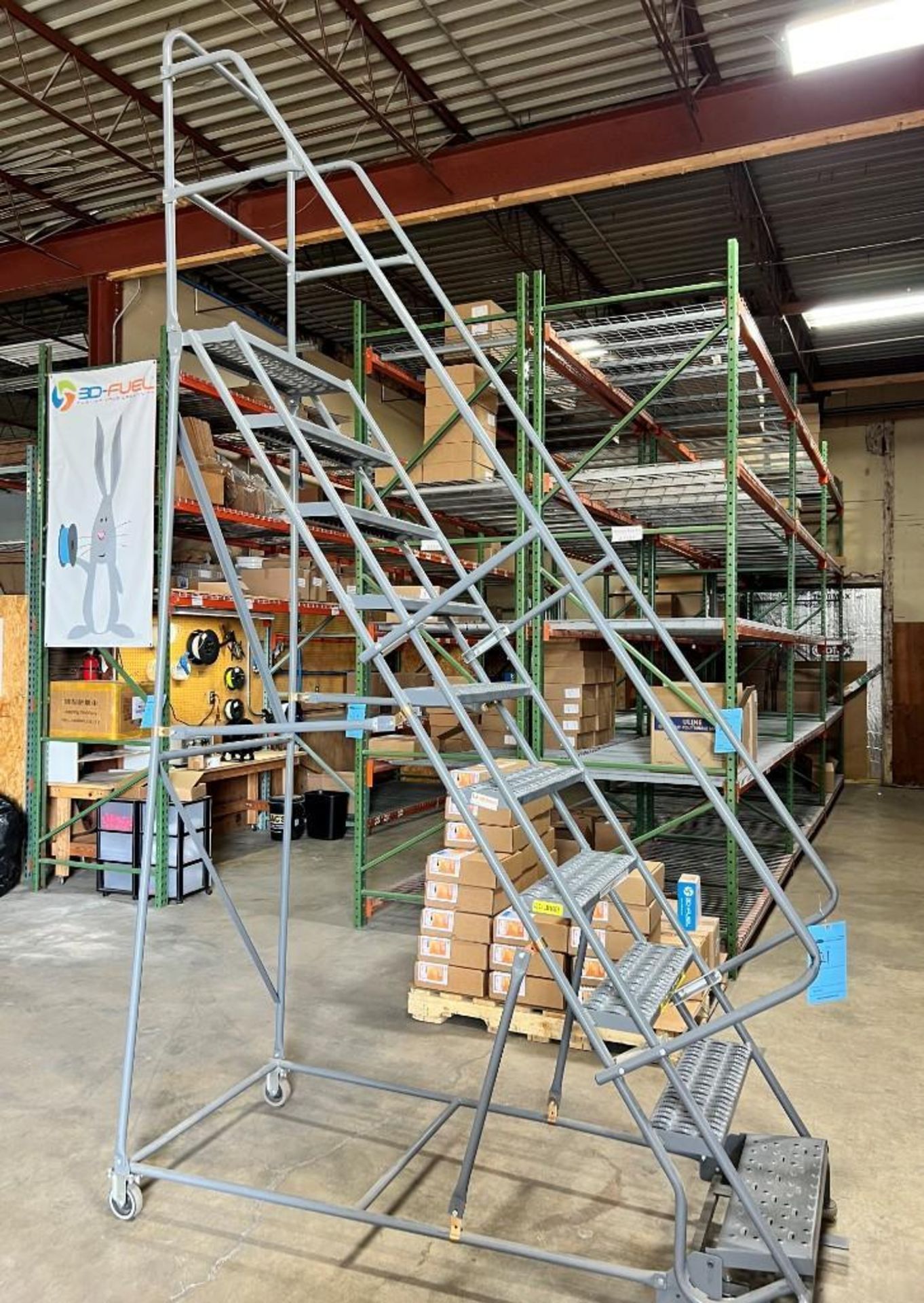 Tri-Arc (10) Step Rolling Warehouse Ladder, 450 Pound Capacity.