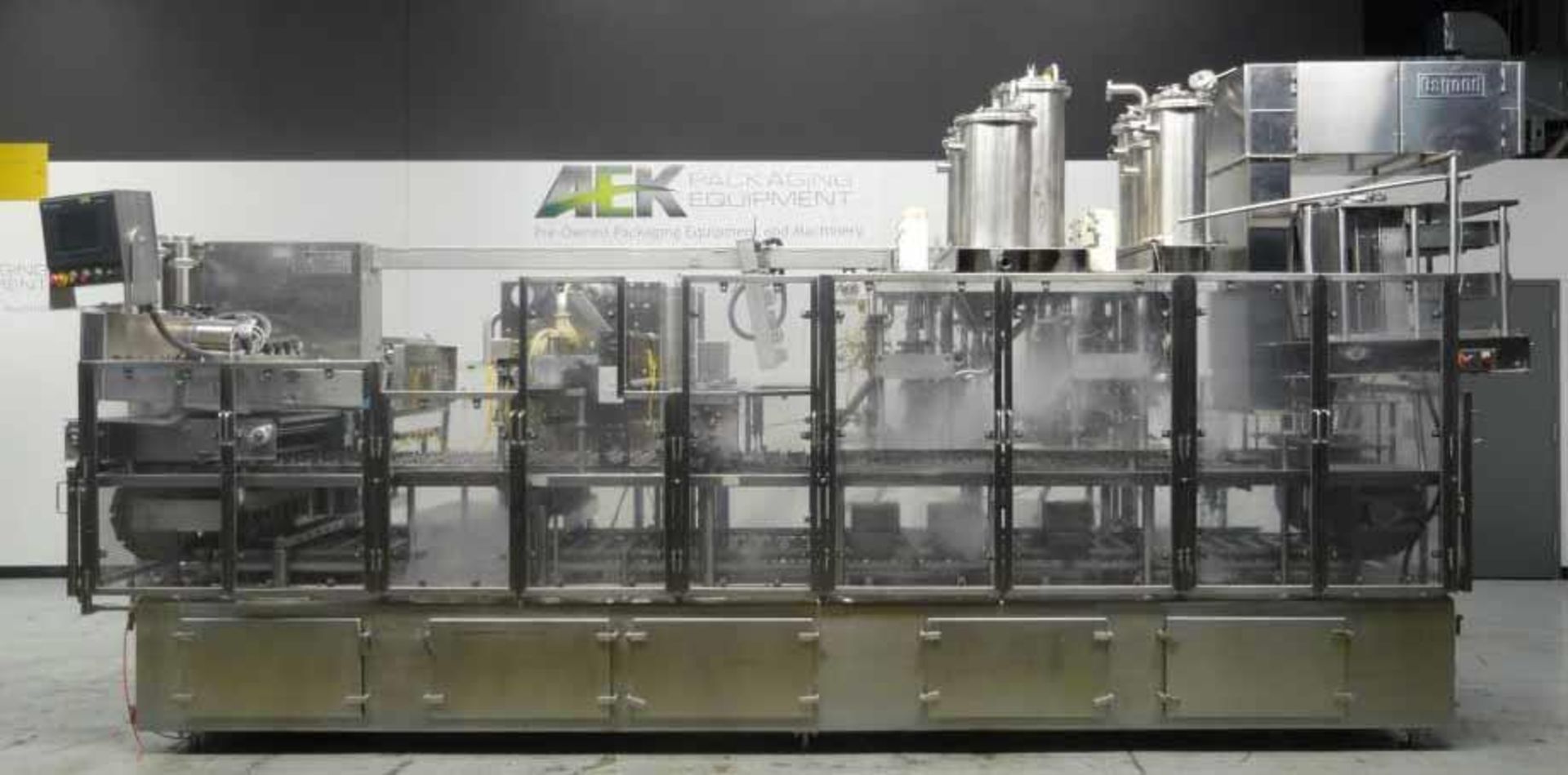 Used- Osgood Model 6400 FOB Cup Filler. Capable of speeds up to 240 cups per minute (depending on ap