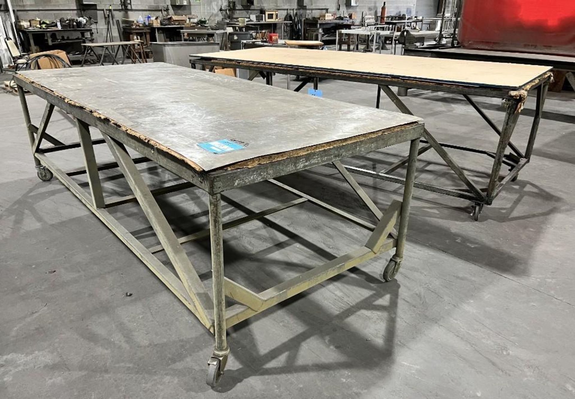 Lot Of (2) Portable Work Tables. Approximate 48" wide x 120" long x 36" tall.