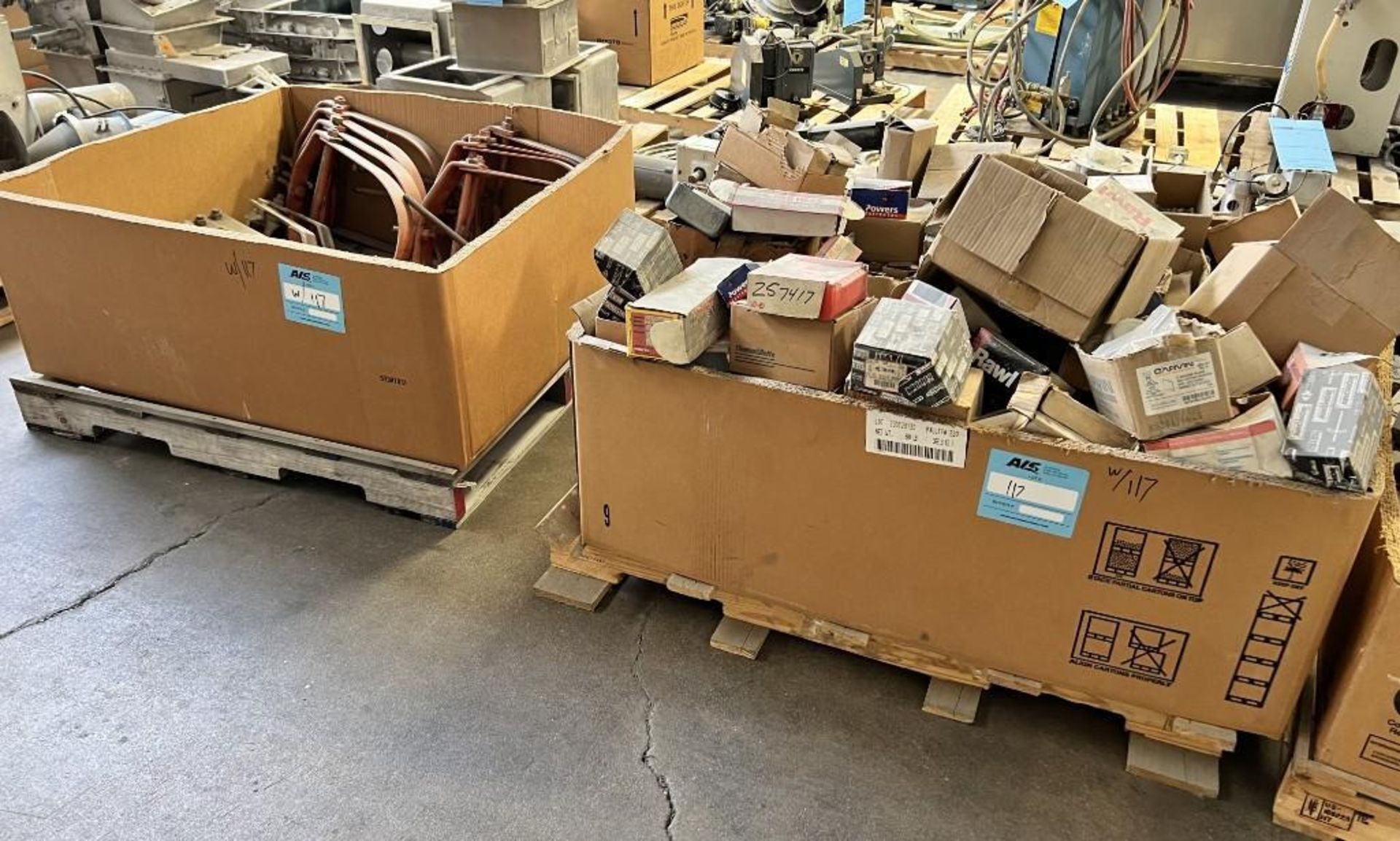 Lot Of (2) Skids. With misc. electrical hardware and pipe hangers. (Rigging/Loading Fee = $100)