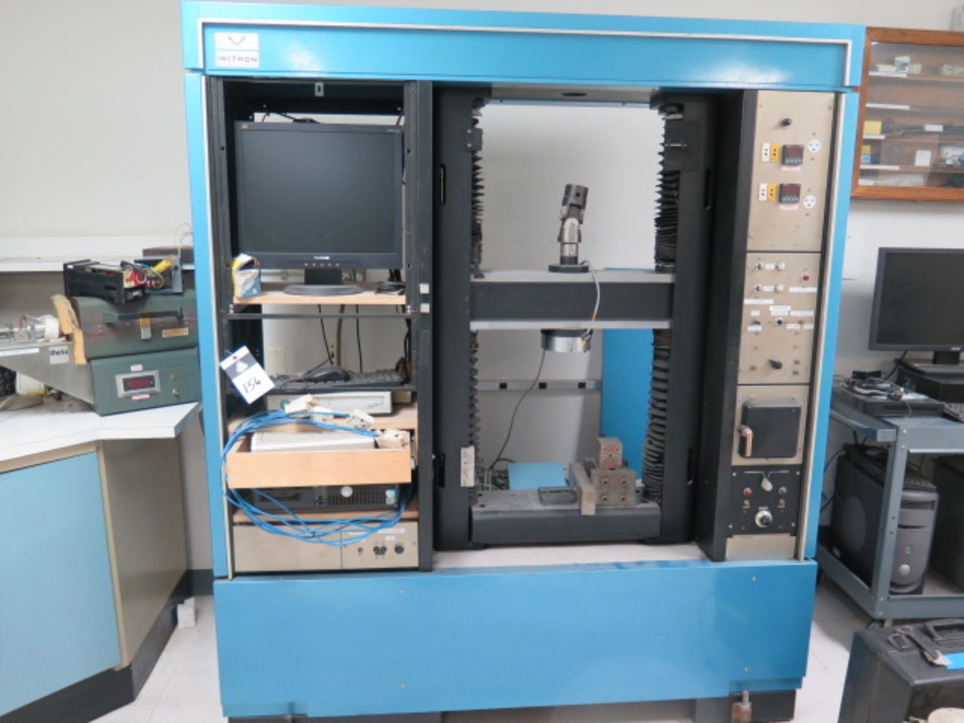 Instron Universal Tension and Compression Testing w/ Instron Controls, Test Fixtures, SOLD AS IS