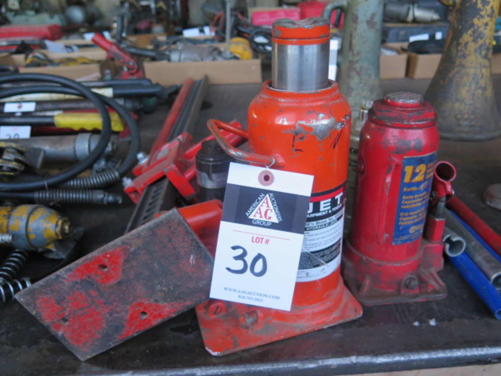 Hydraulic Bottle Jacks (4) and 48" Farm Jack (SOLD AS-IS - NO WARRANTY)