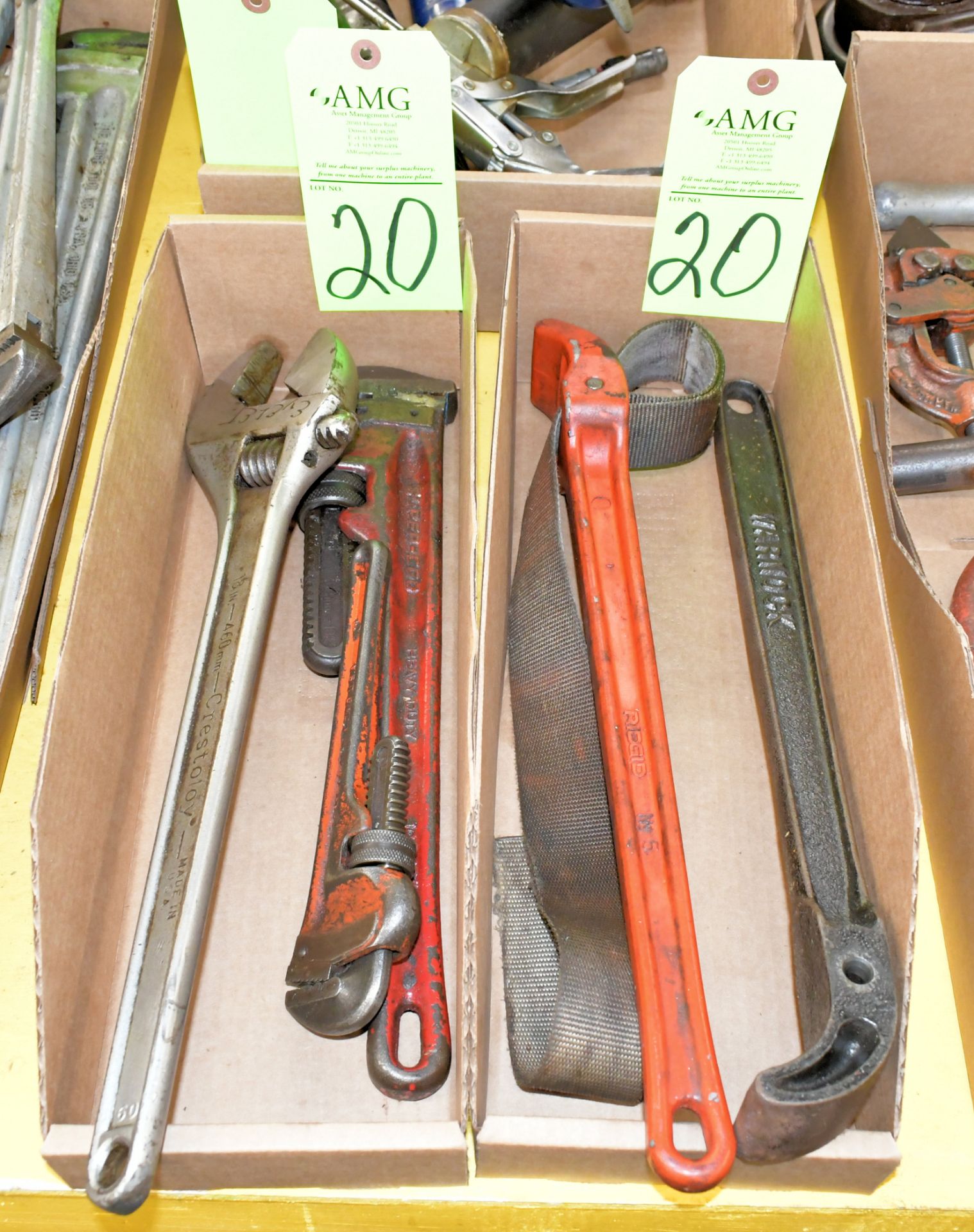 Lot-(2) Various Small Pipe Wrenches, (2) Pipe Strap Wrenches, and (1) Large Adjustable Wrench in (2)