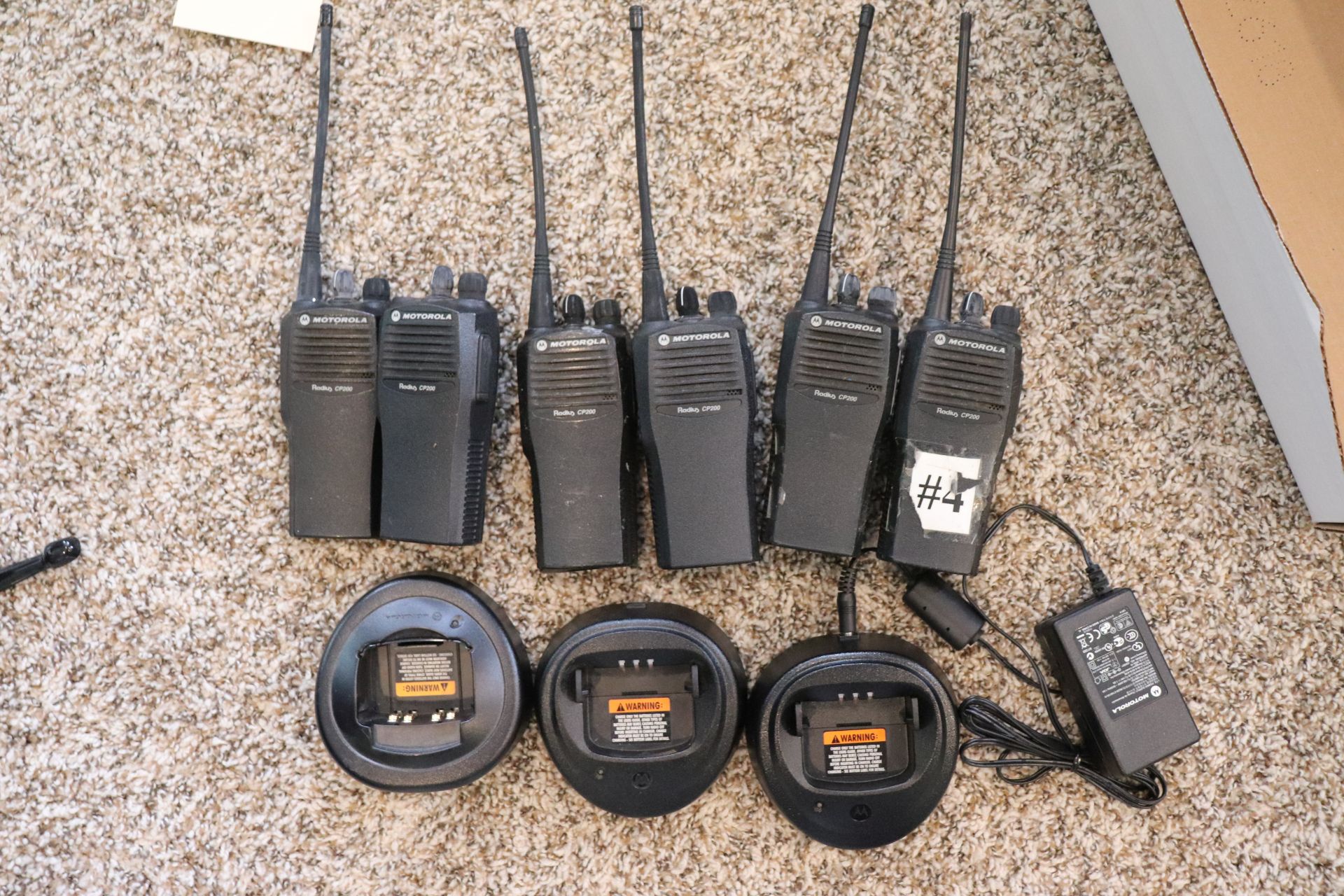 Box lot of six Motorola Two-Way Radios, model Radius CP200, comes with three charging stands