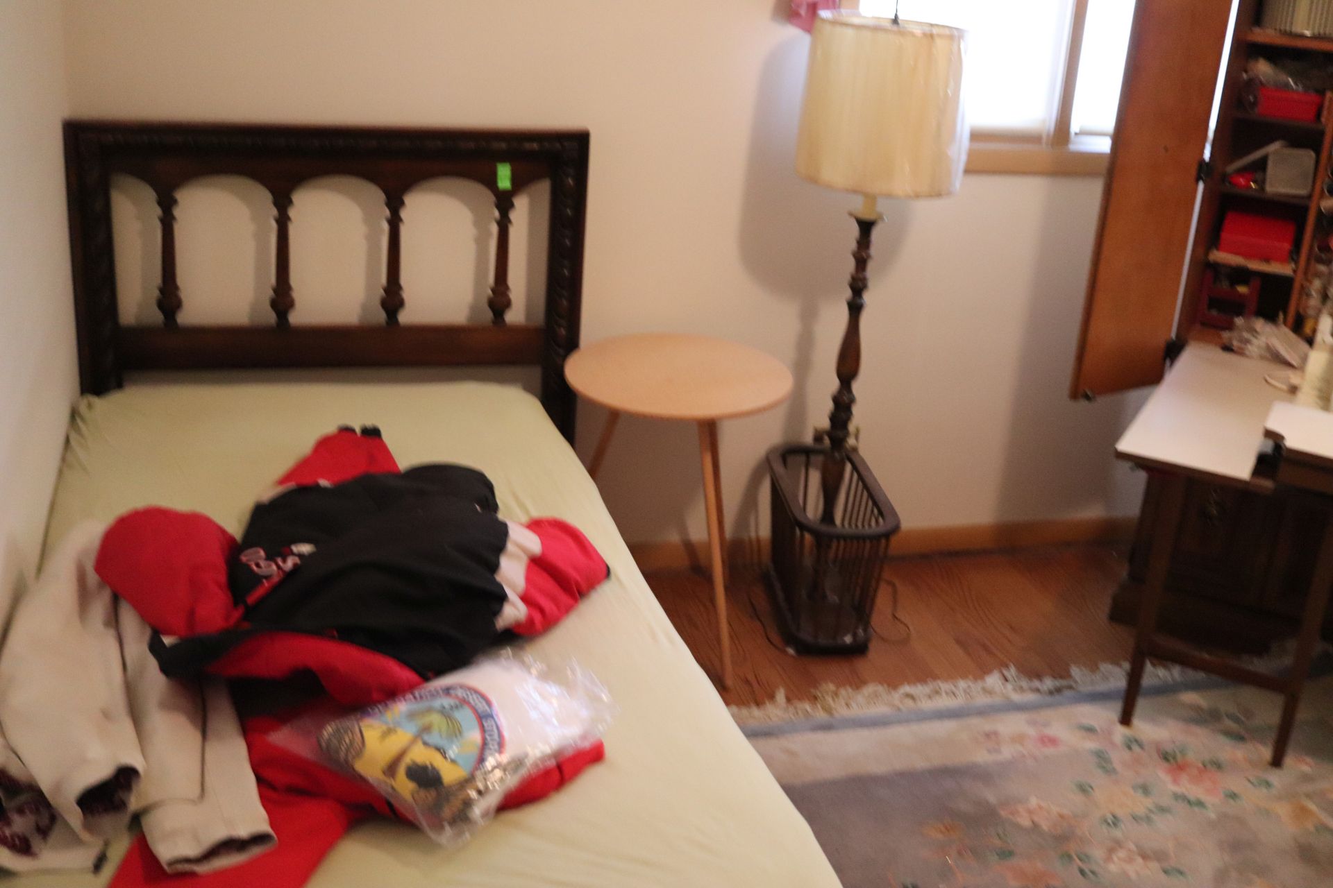 Single bed, wooden headboard with matching floor lamp