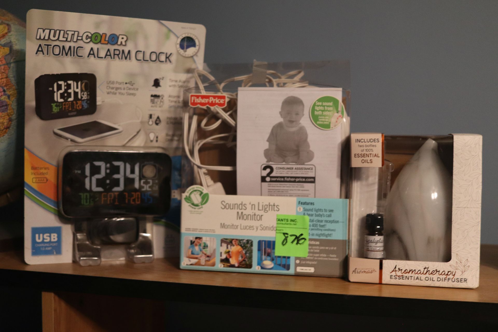 Group including everything on top of entertainment center, globe, alarm clock, baby monitor, essenti - Image 3 of 4