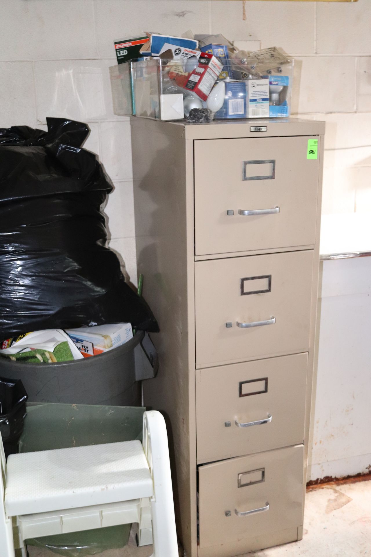 Filing cabinet with light bulb collection