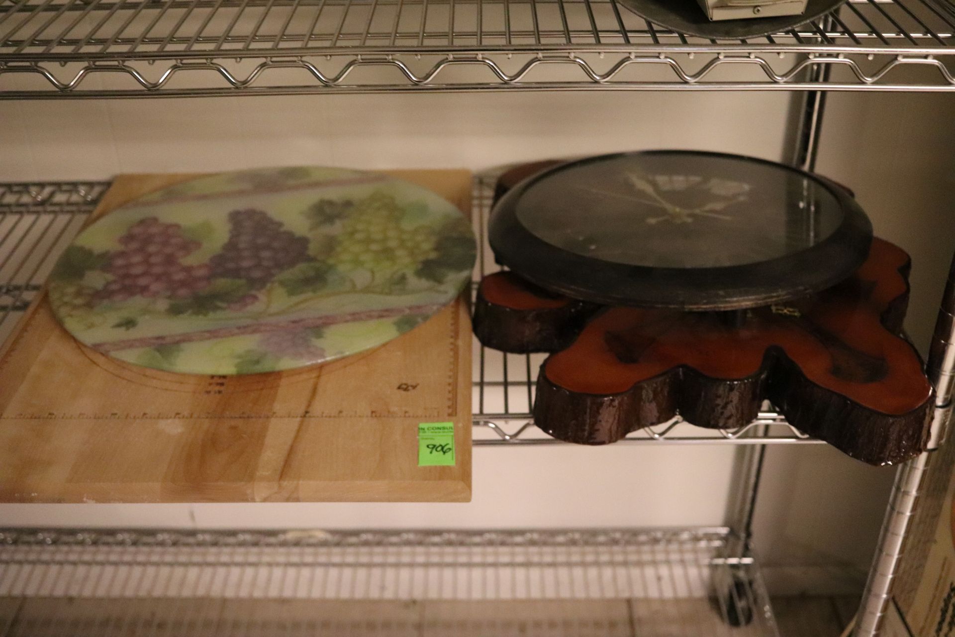 Two wall clocks, pastry cutting board, and a Lazy Susan