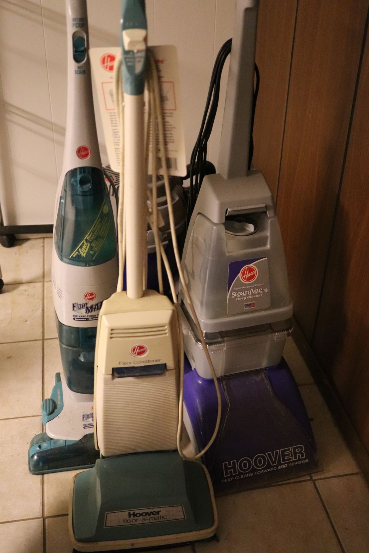 Three Hoover rug cleaners: Hoover Floormatic, Hoover Floormate, model H3000, and Hoover model F5808