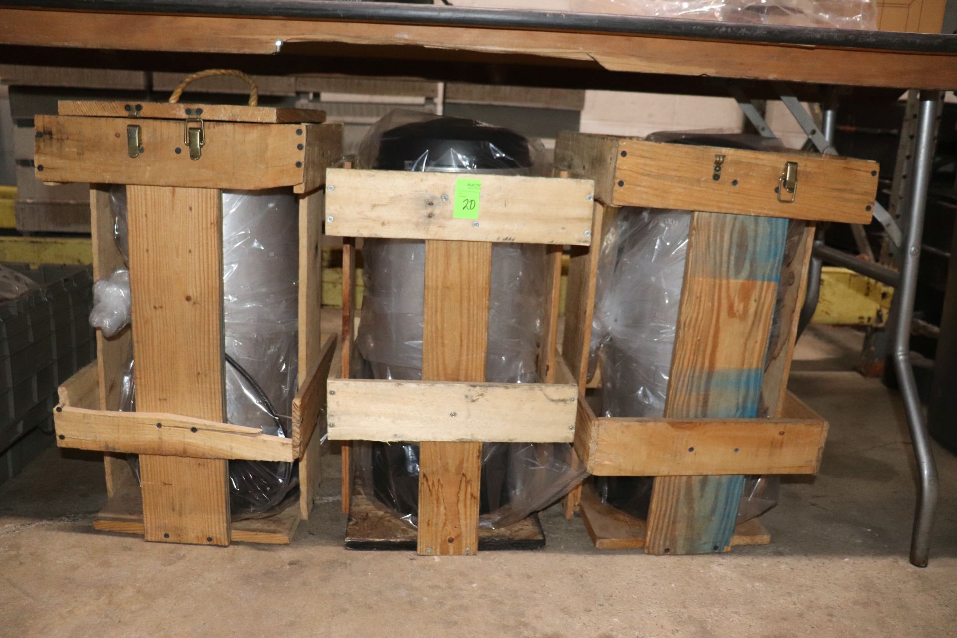 Three coffee brewers in wood crates