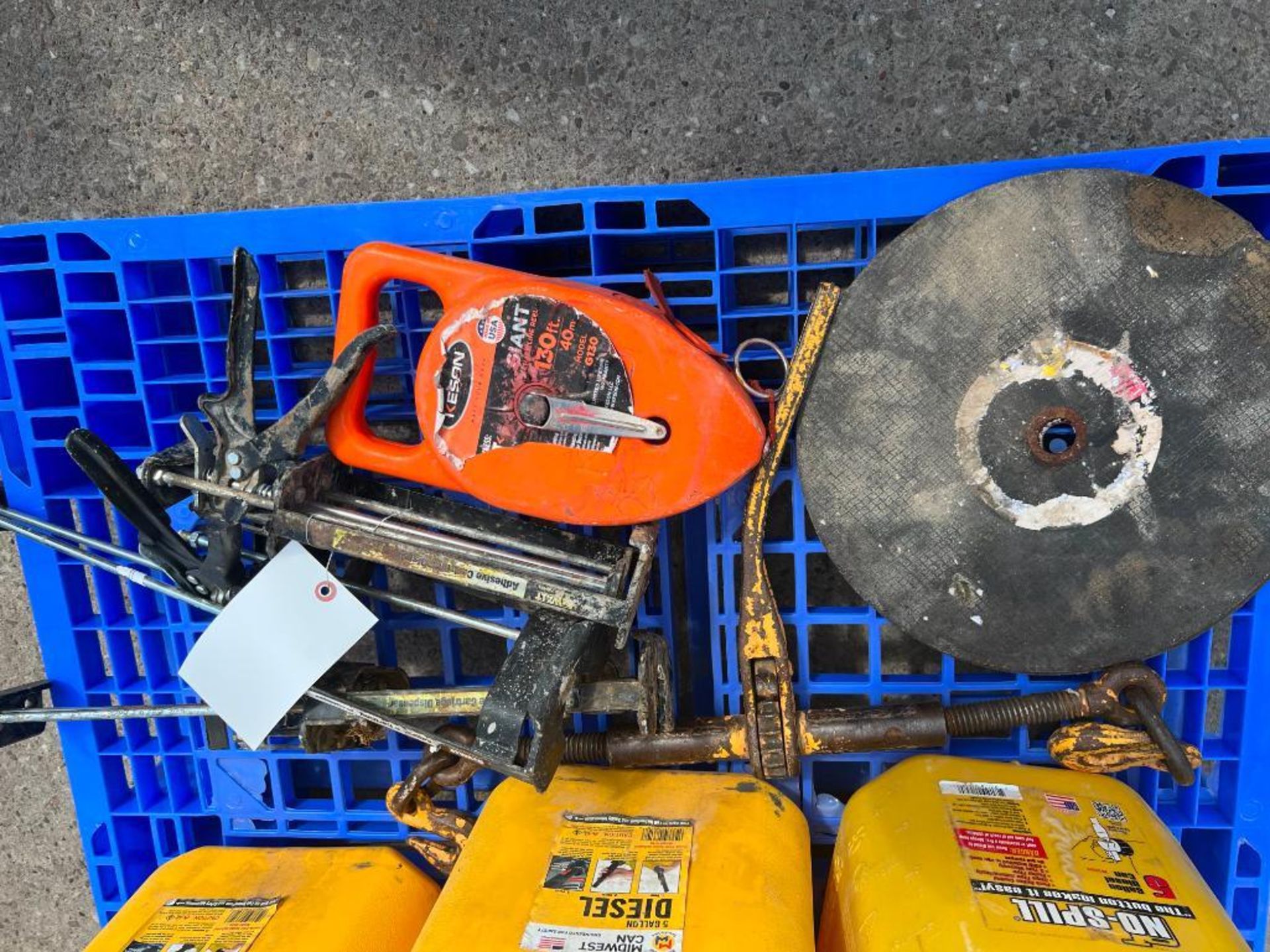 Saw Blade, 130' Tape Measure, Caulking Guns, Rachet Chain Binder. Located in Mt. Pleasant, IA