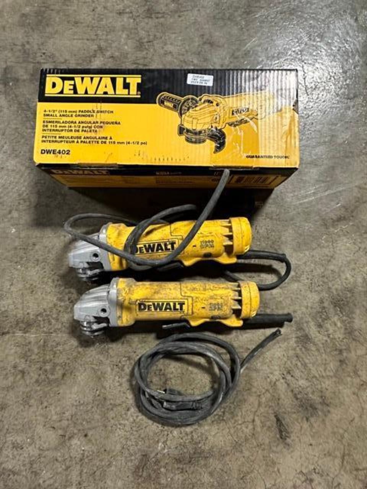 (1) NEW DeWalt DWE402 4-1/2" angle grinder (2) DeWalt DWE402 4-1/2" angle grinder