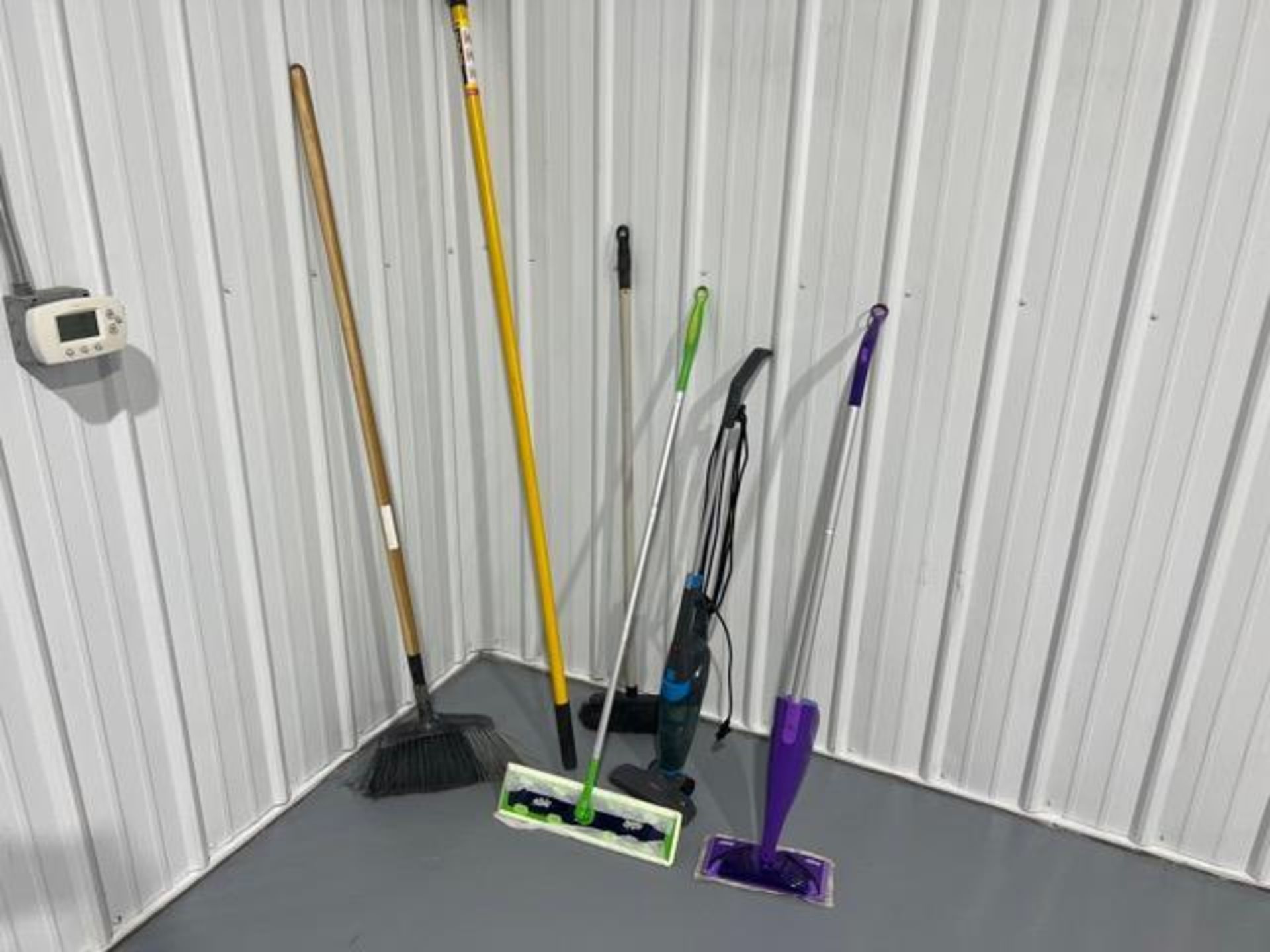 (2) Broom, extension pole, (2) Swiffer mops, vacuum