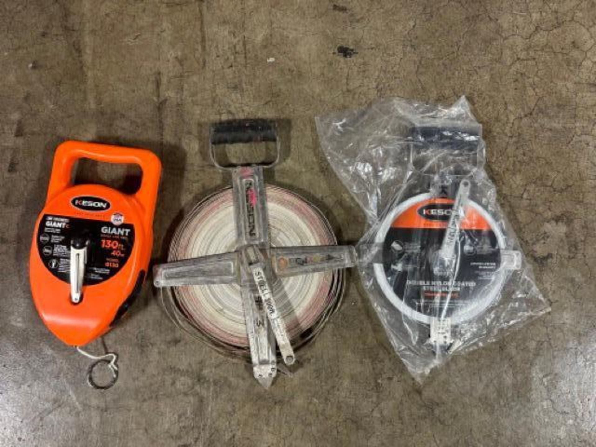 (1) NEW Keson 200' steel measuring tape, (1) Keson 300' steel measuring tape, (1) NEW Keson Giant 13