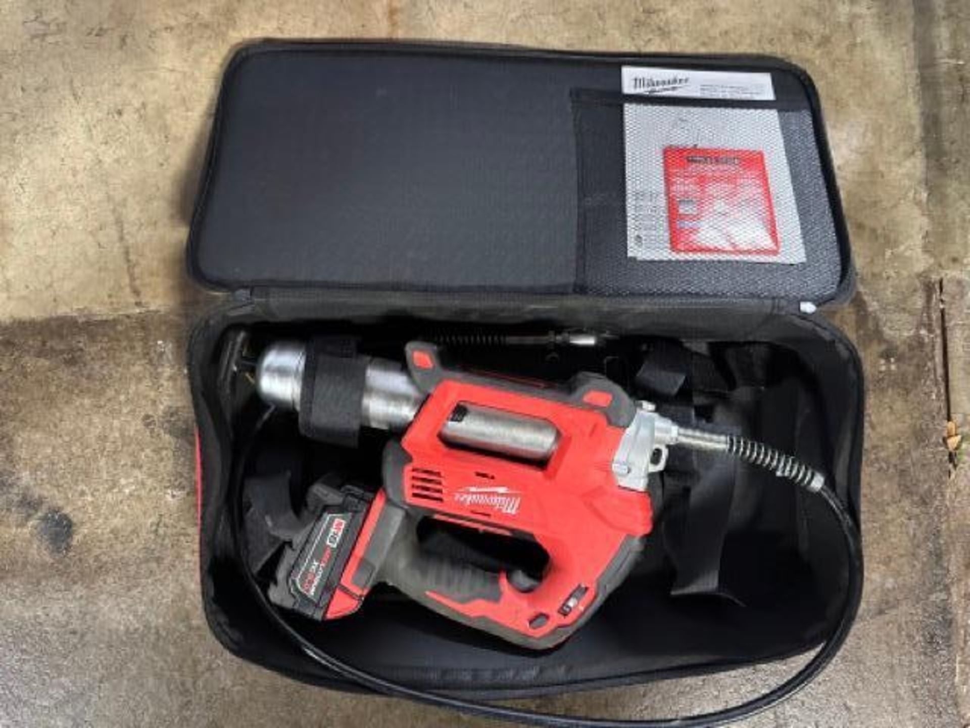 Milwaukee M18 grease gun with battery and charger (charger not pictured)
