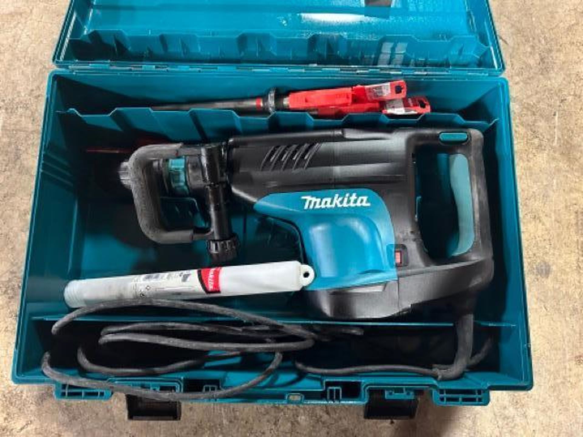 Makita HM1203C SDS Max demolition hammer, like new, includes NEW Hilti bits