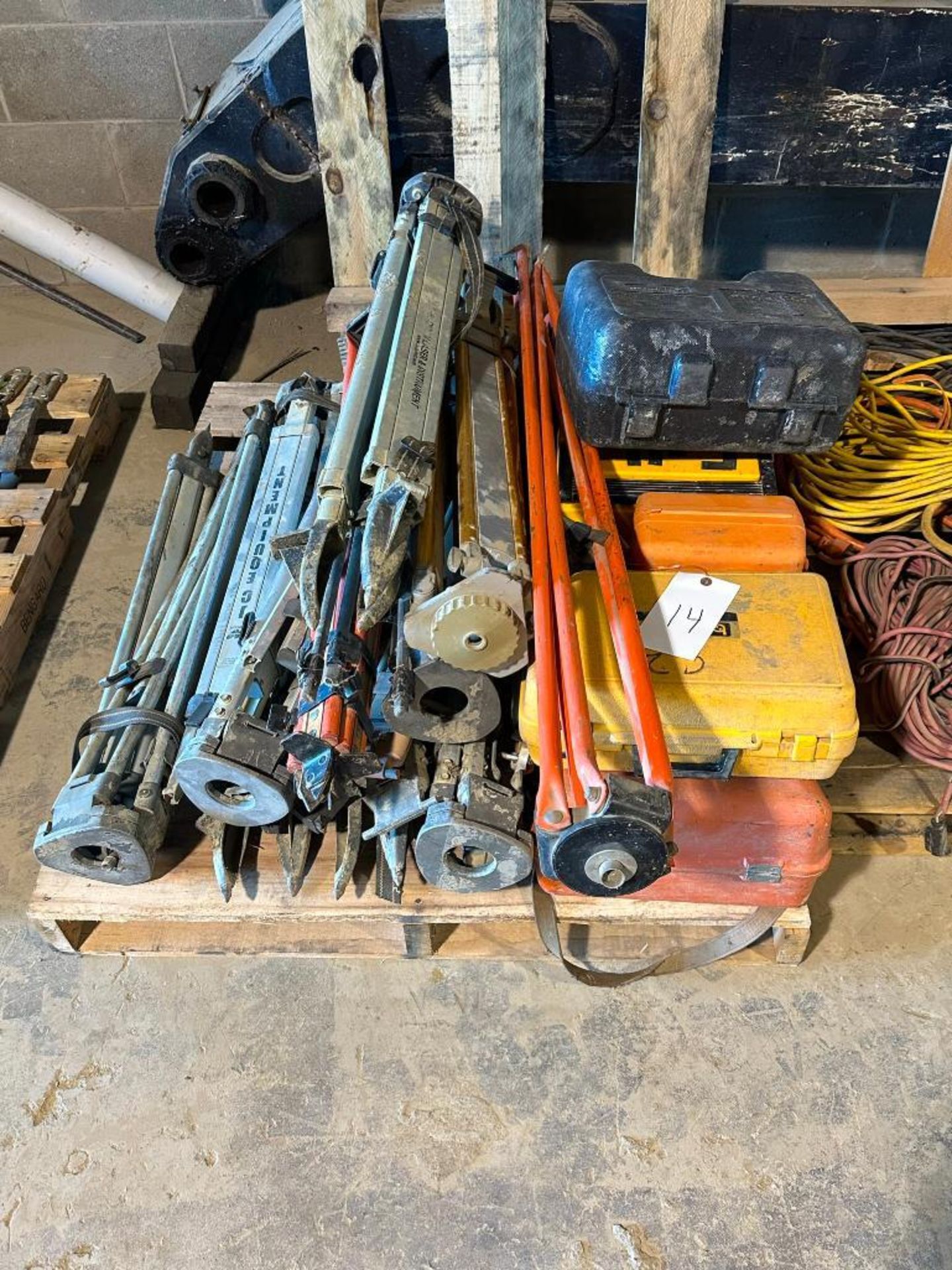 pallet of surveying equipment to include lasers and tripods, unknown condition