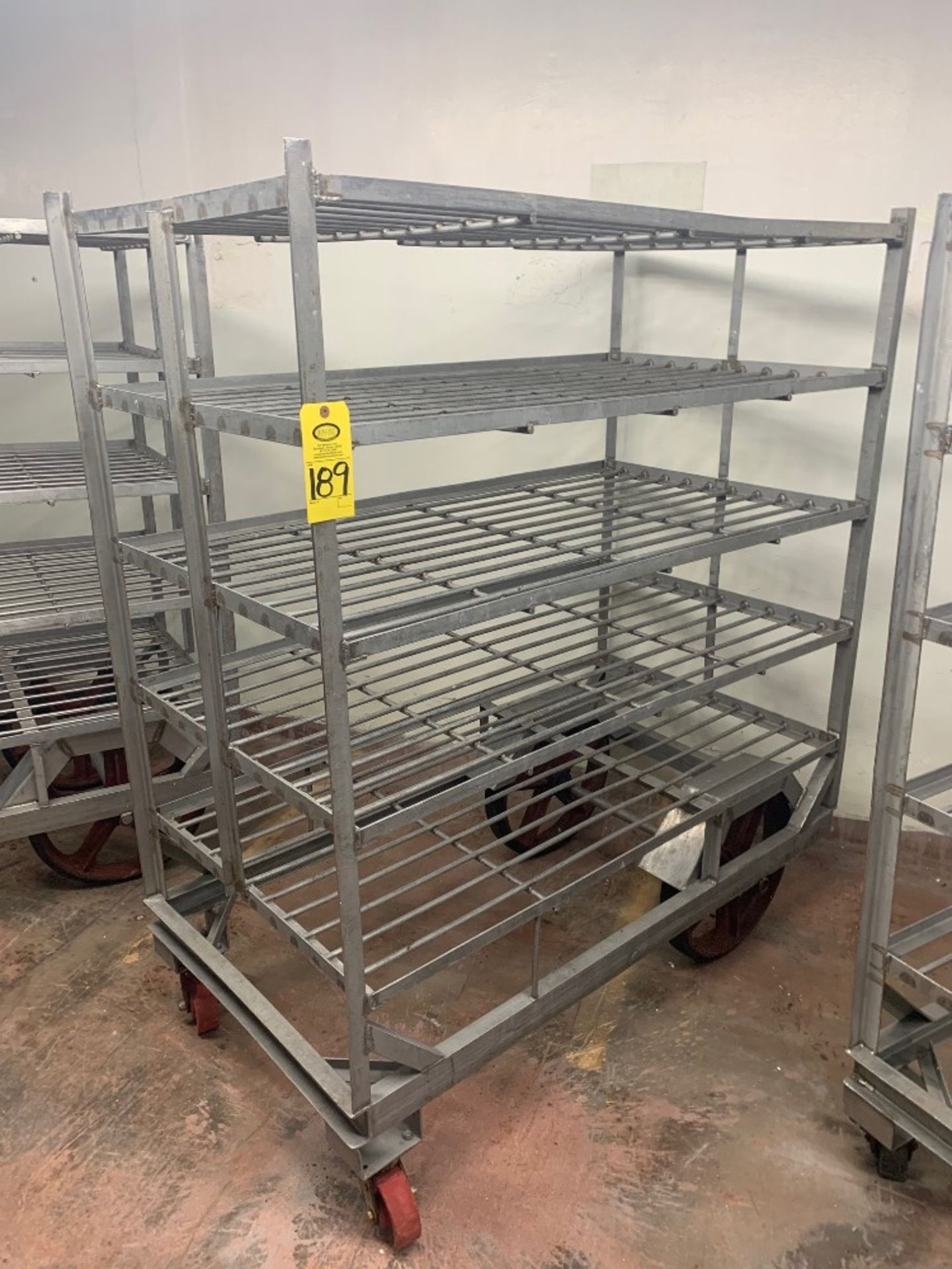 Stainless Steel Cart, 34" W X 62" X 6' T, 5-shelves, 20" rear wheels: Required Loading Fee $100.
