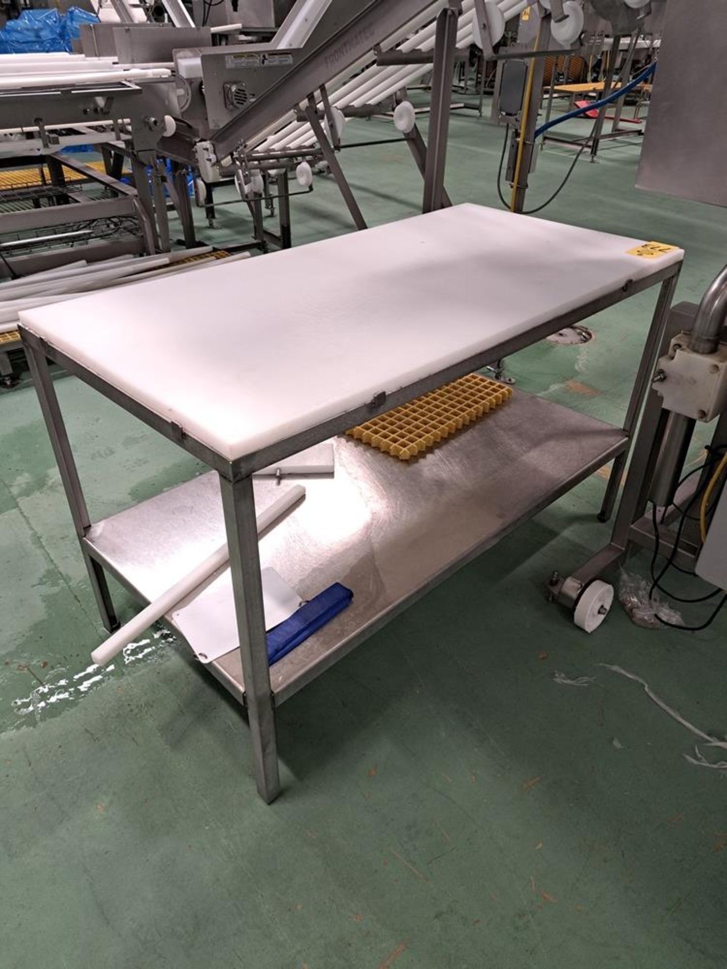 Stainless Steel Table, 30" W X 6' L X 36" T, poly top: Required Loading Fee $150.00, Rigger-Norm