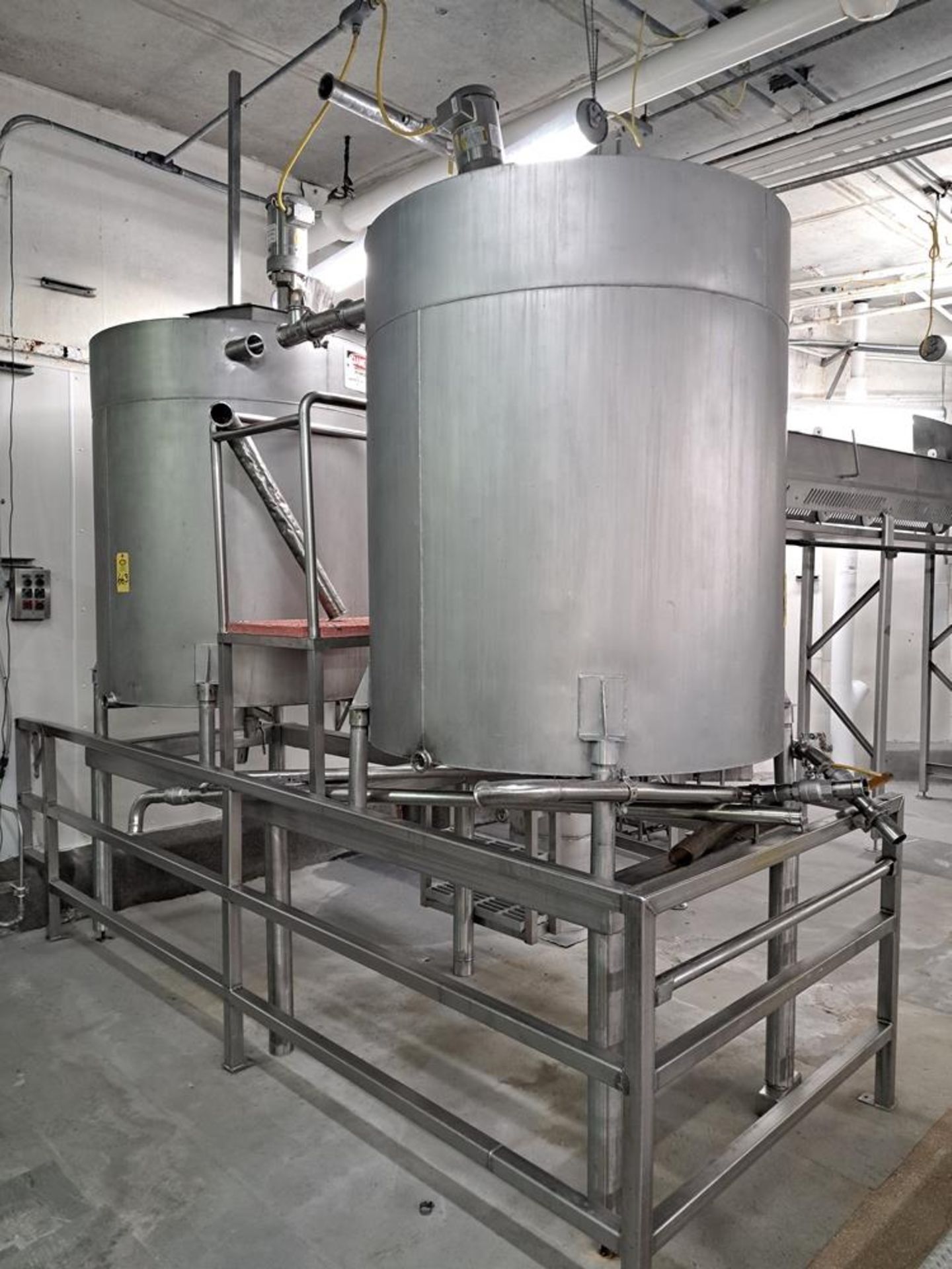 Stainless Steel Brine Mixing Station, (2) stainless steel tanks with 4' Dia. X 5' D with mixers on