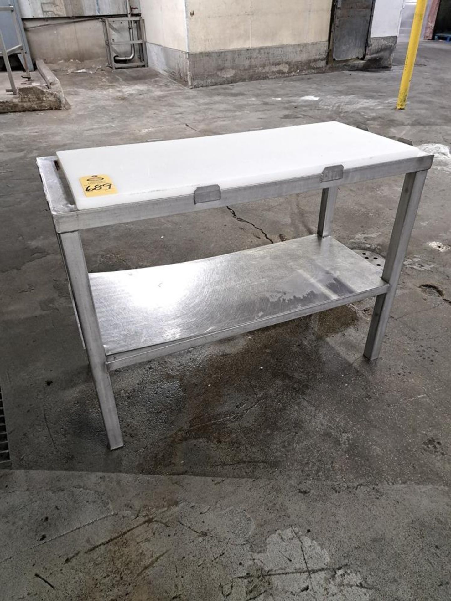 Stainless Steel Table, 21" W X 4' L, partial poly top: Required Loading Fee $100.00, Rigger-Norm